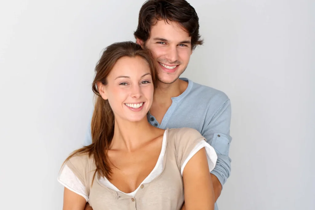 Happy couple embracing with smiles